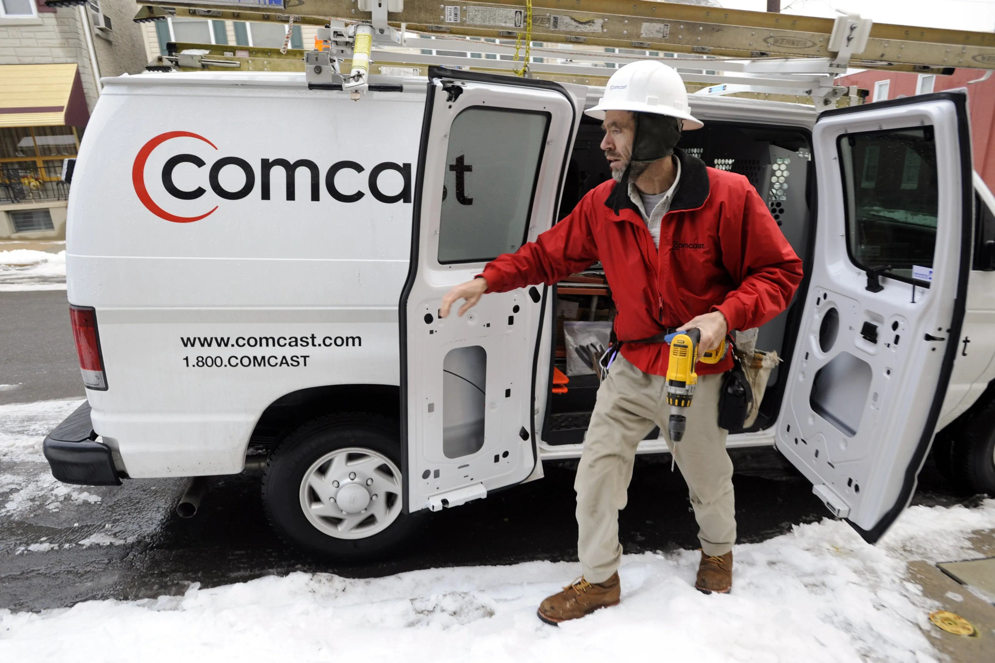A Comcast Corp. field service technician, arrives to install cable service at a residence in Reading, Pennsylvania, U.S.