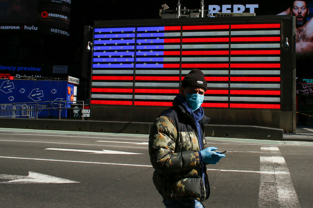 A man wears a face mask in Times Square,&nbsp;New York City