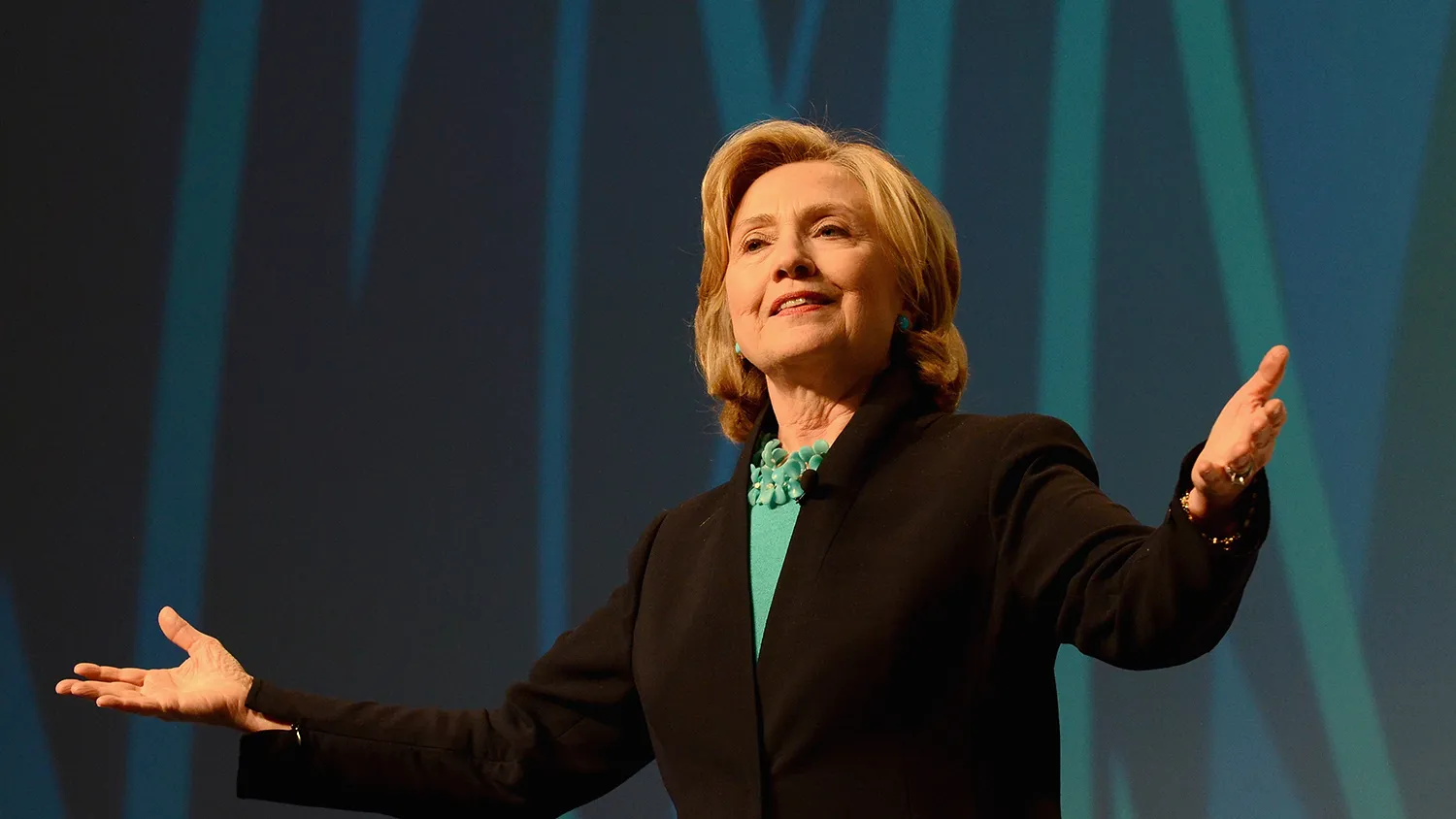 Former United States Secretary of State, Hillary Rodham Clinton speaks on stage at the 2014 Massachusetts Conference for Women at Boston Convention &amp; Exhibition Center on December 4, 2014 in Boston, Massachusetts.
