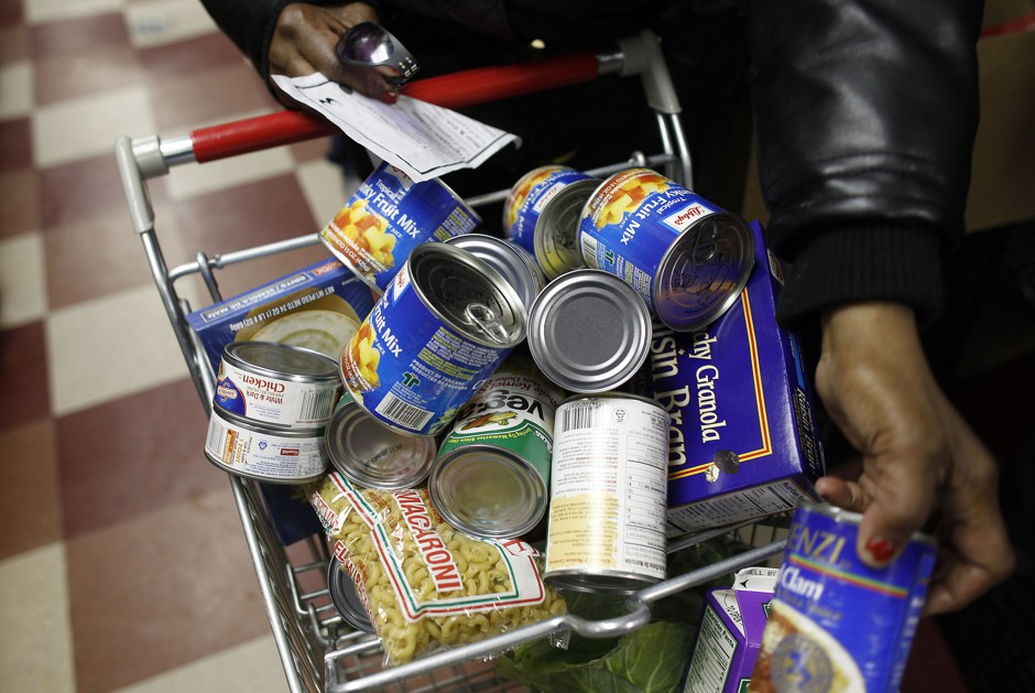 A shopper fills her cart at the Food Bank For New York City Community Kitchen & Food Pantry of West Harlem.