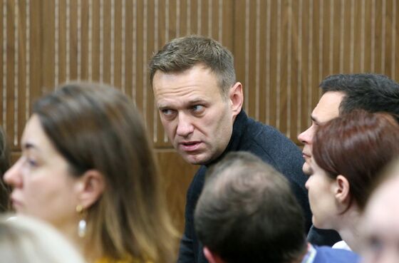Masked Russian Police Raid Opposition Leader Navalny’s Office