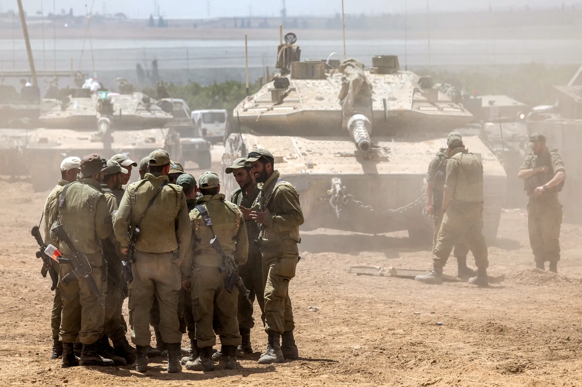 Israeli army soldiers huddle&nbsp;in southern Israel on May 9.