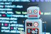 Robot toy in front of program code