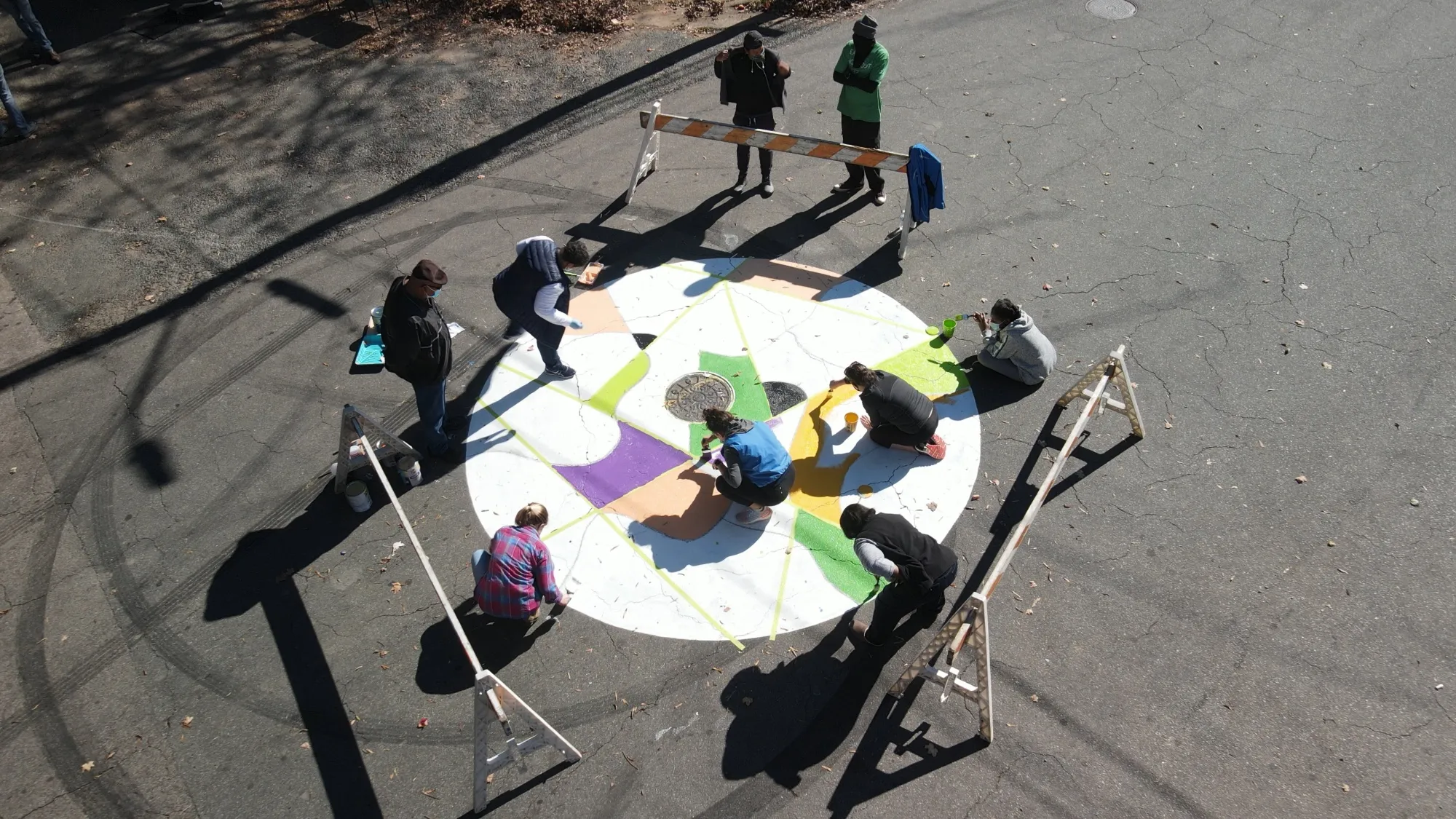 Residents of East Durham paint a traffic-calming circle on a Shared Street corridor.