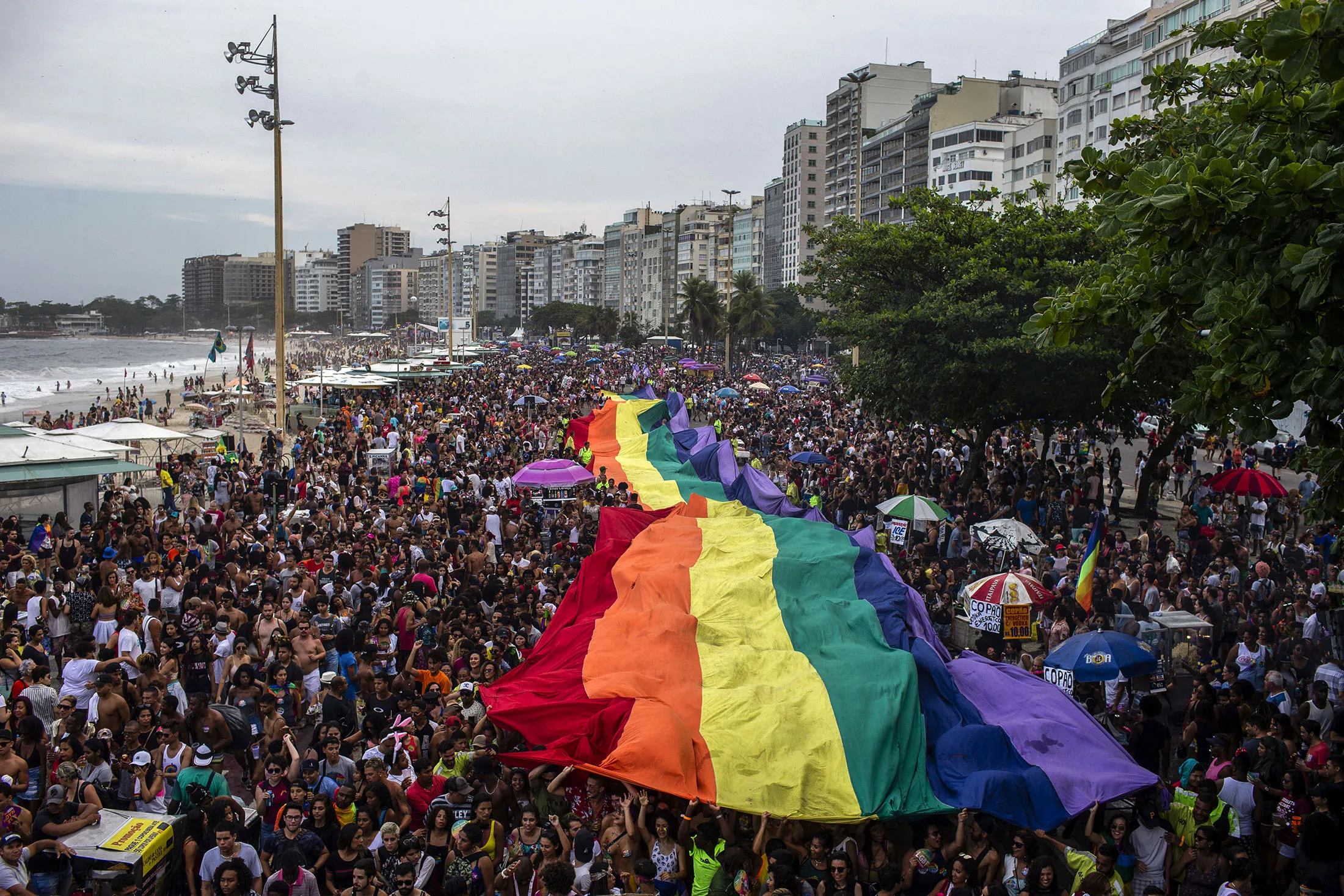People attend the Gay Pride parade at Copacabana Beach on Sept. 30.