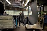 The mill's old-school looms turn out fabric for jeans prized by denim fans, who covet their imperfections and durability