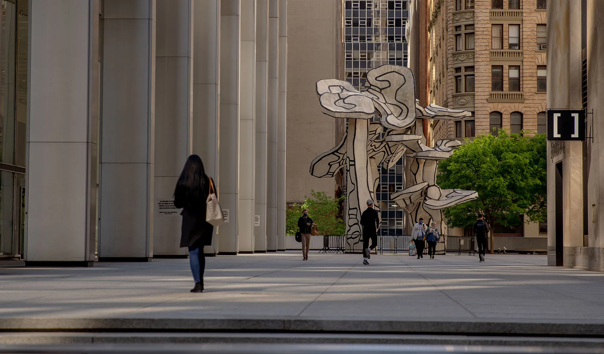 Pedestrians&nbsp;in the Financial District of New York,&nbsp;on&nbsp;May 12.