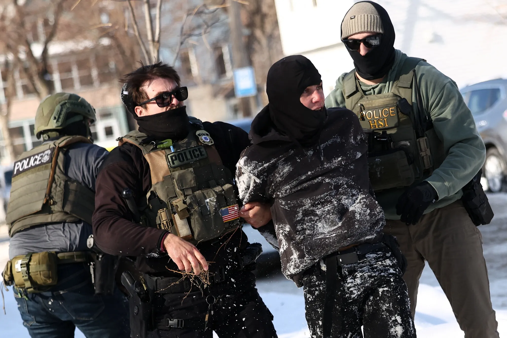 Federal agents detain a protester in Minneapolis on Feb. 3.