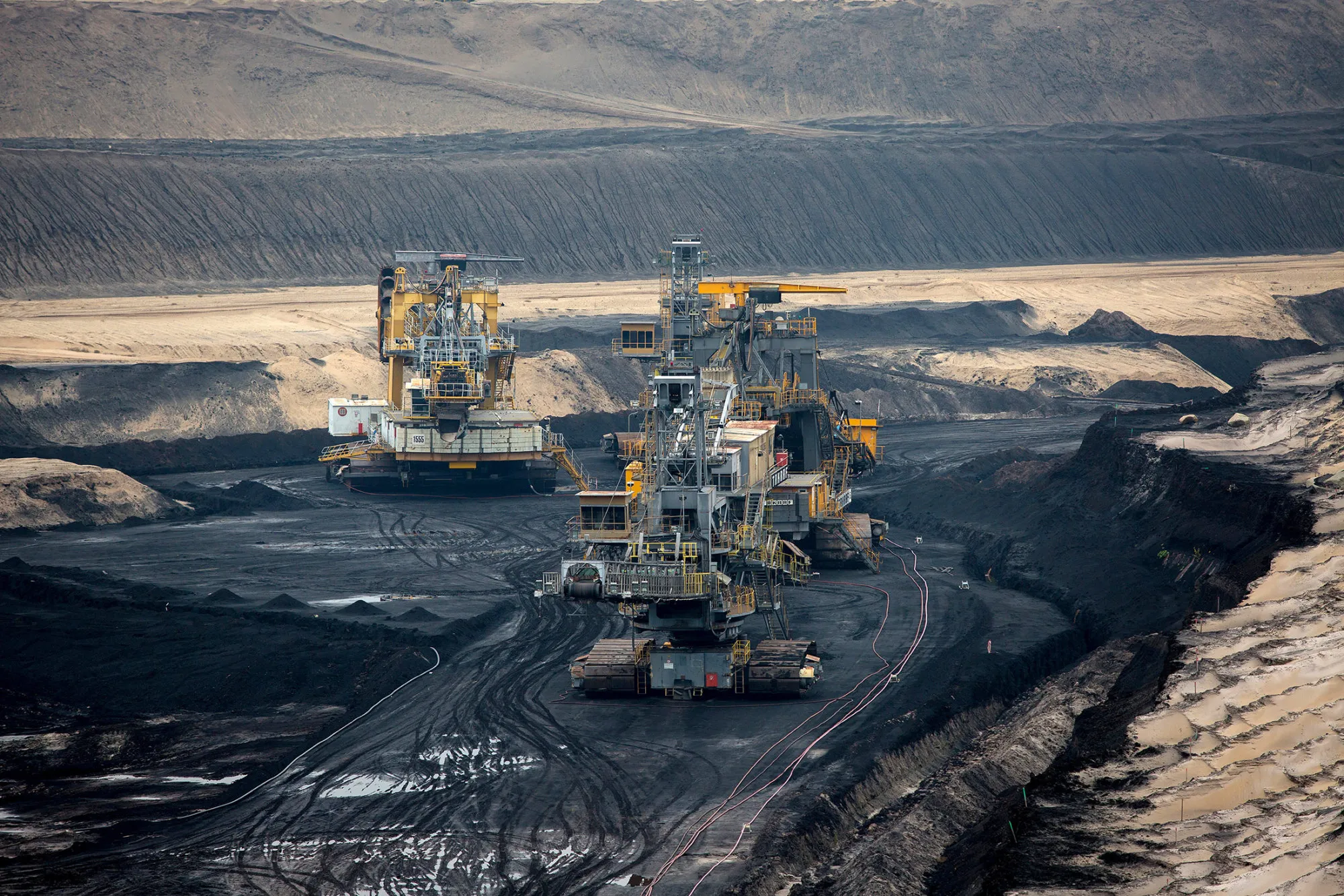 Giant excavators operate at Jaenschwalde open pit lignite mine, operated Vattenfall AB, in Jaenschwalde.
