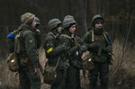 Ukrainian servicemen north of Kyiv on Feb. 24.