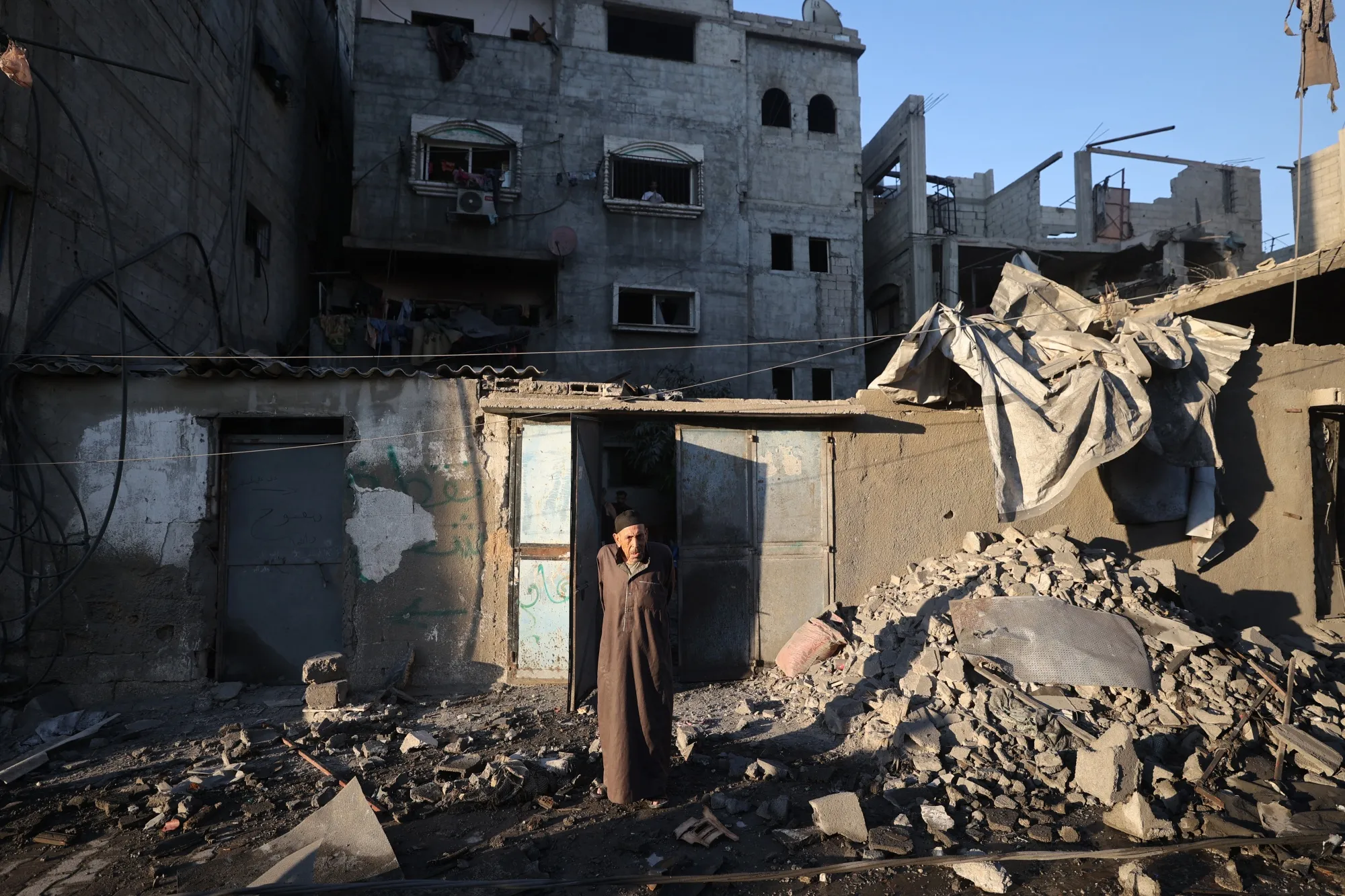 A Palestinian man reacts to the damage after an Israeli strike on the Bureij refugee camp in Gaza on July 23.
