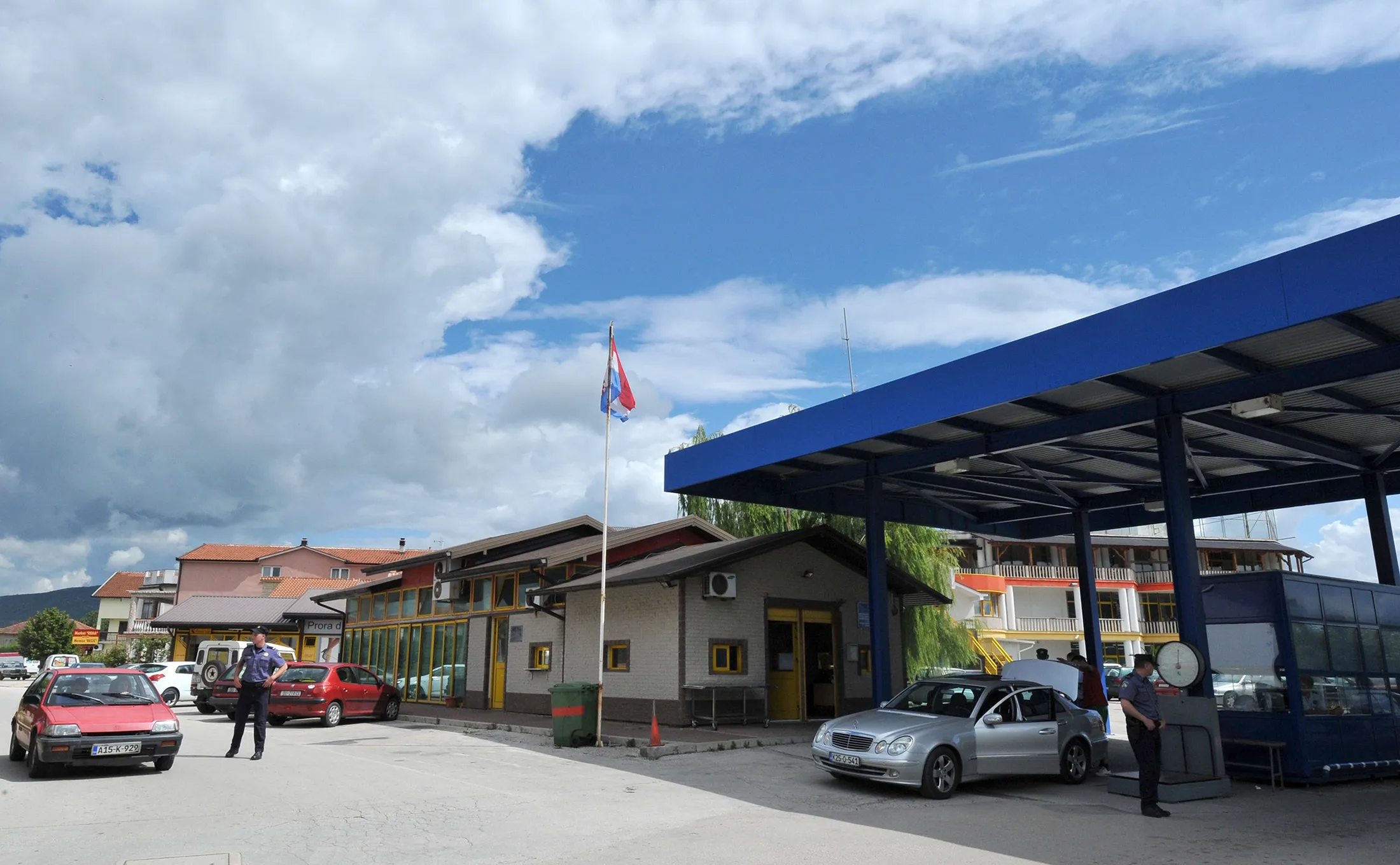 A police officer stands at the border crossing between Croatia and Bosnia, near the Croatian town of Metkovic