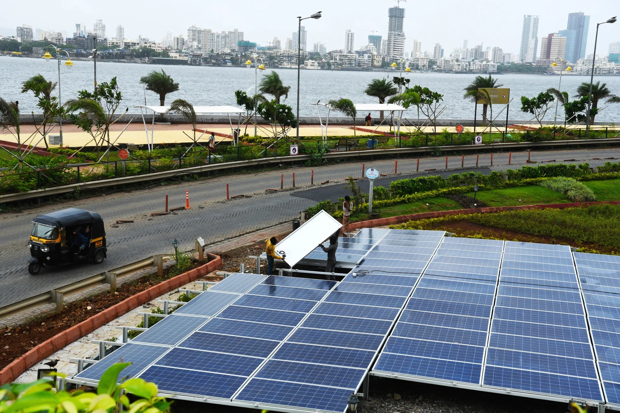 Workers install&nbsp;the solar panels&nbsp;in Mumbai.