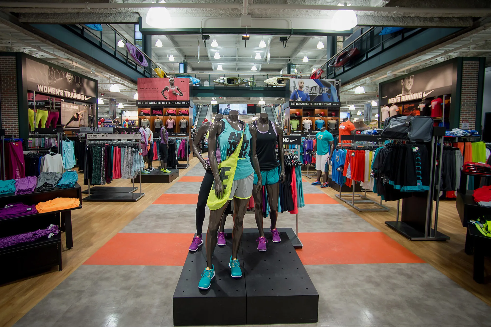 Mannequins stand next to merchandise displayed for sale at a Dick's Sporting Goods Inc. store in West Nyack, New York.
