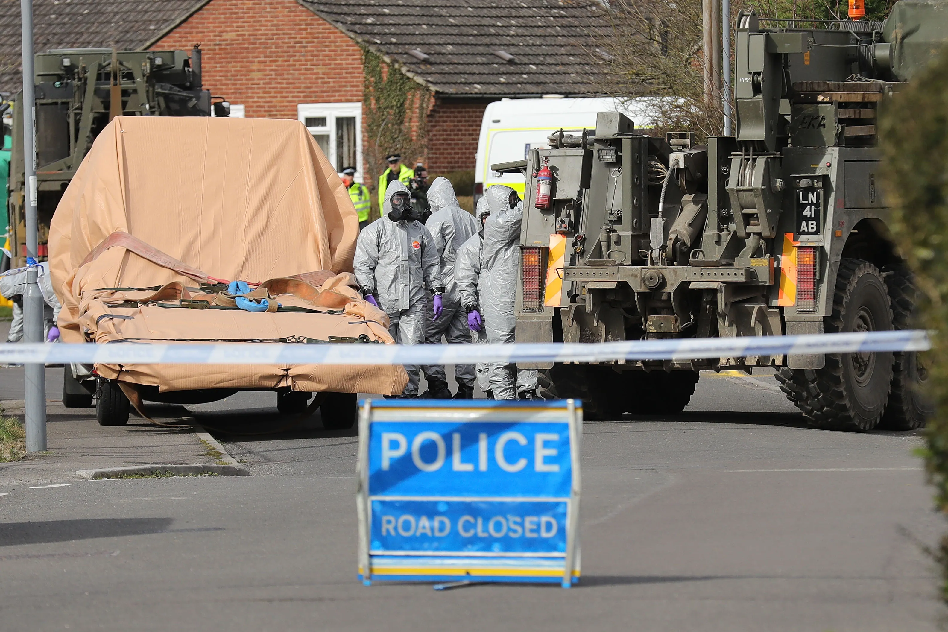 Forensic teams work at an address in Gillingham, England as they remove a recovery truck used following the Salisbury nerve agent attack, on March 14, 2018.