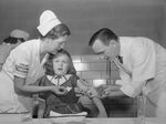 A young girl winces from the sting as she receives the polio vaccine in 1954.