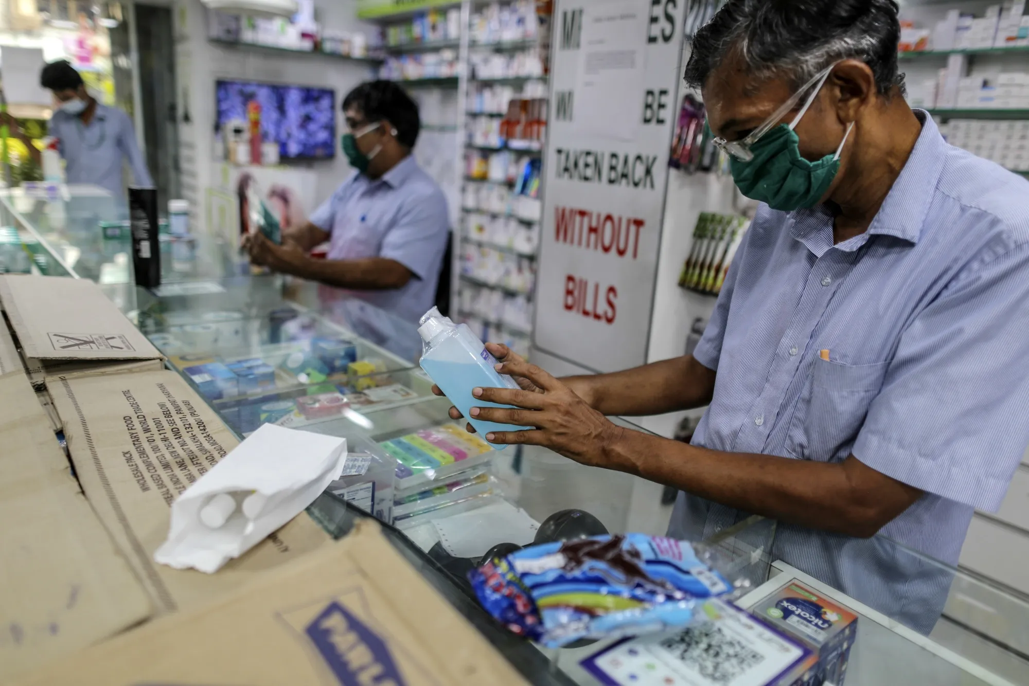 Pharmacy employees in Mumbai serve customers during a Covid pandemic lockdown in 2020.&nbsp;The country, and others, now face the growing threat of drug-resistant bugs.&nbsp;