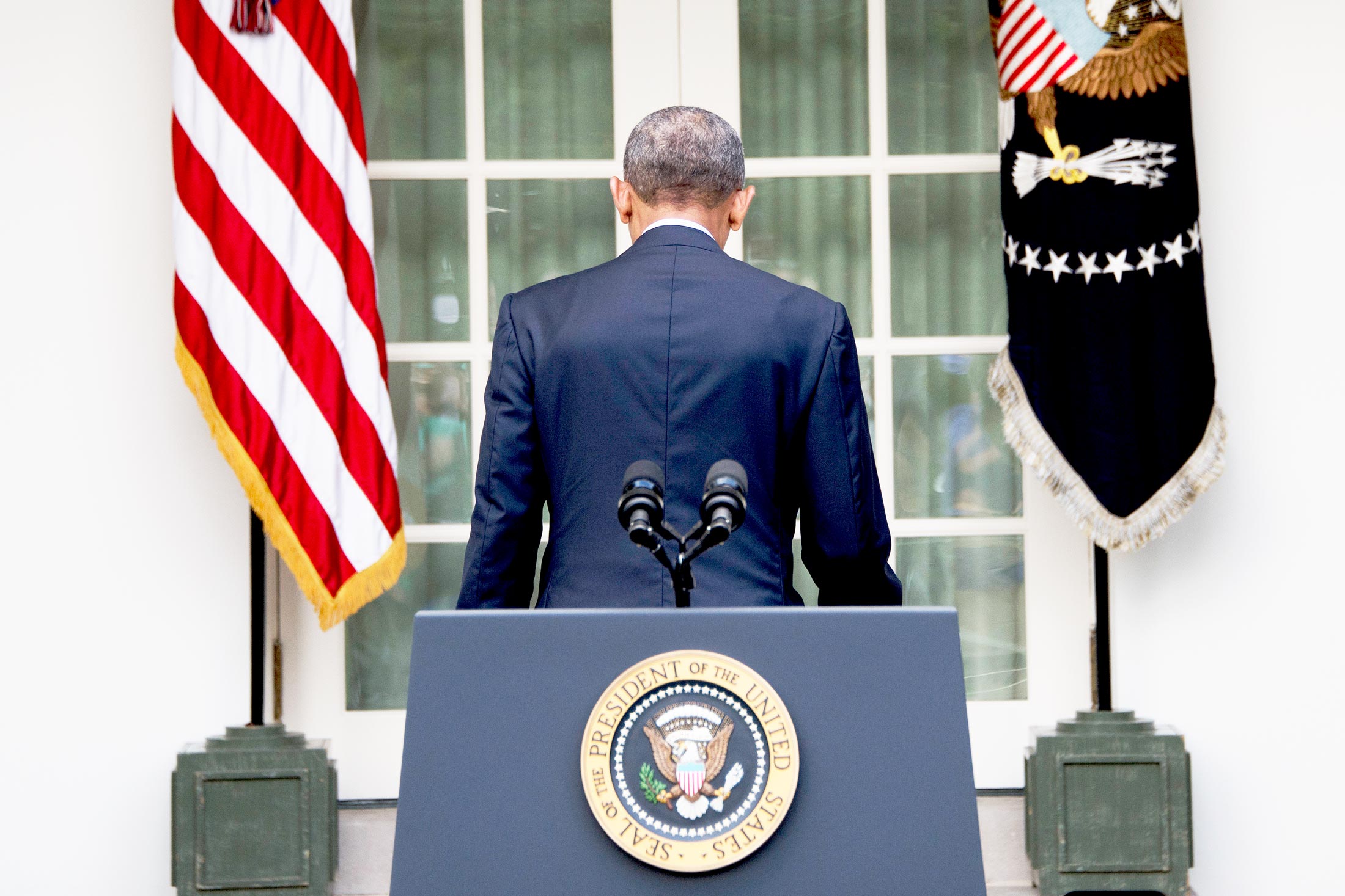 Obama departs after speaking about the Paris agreement from the Rose Garden in October.
