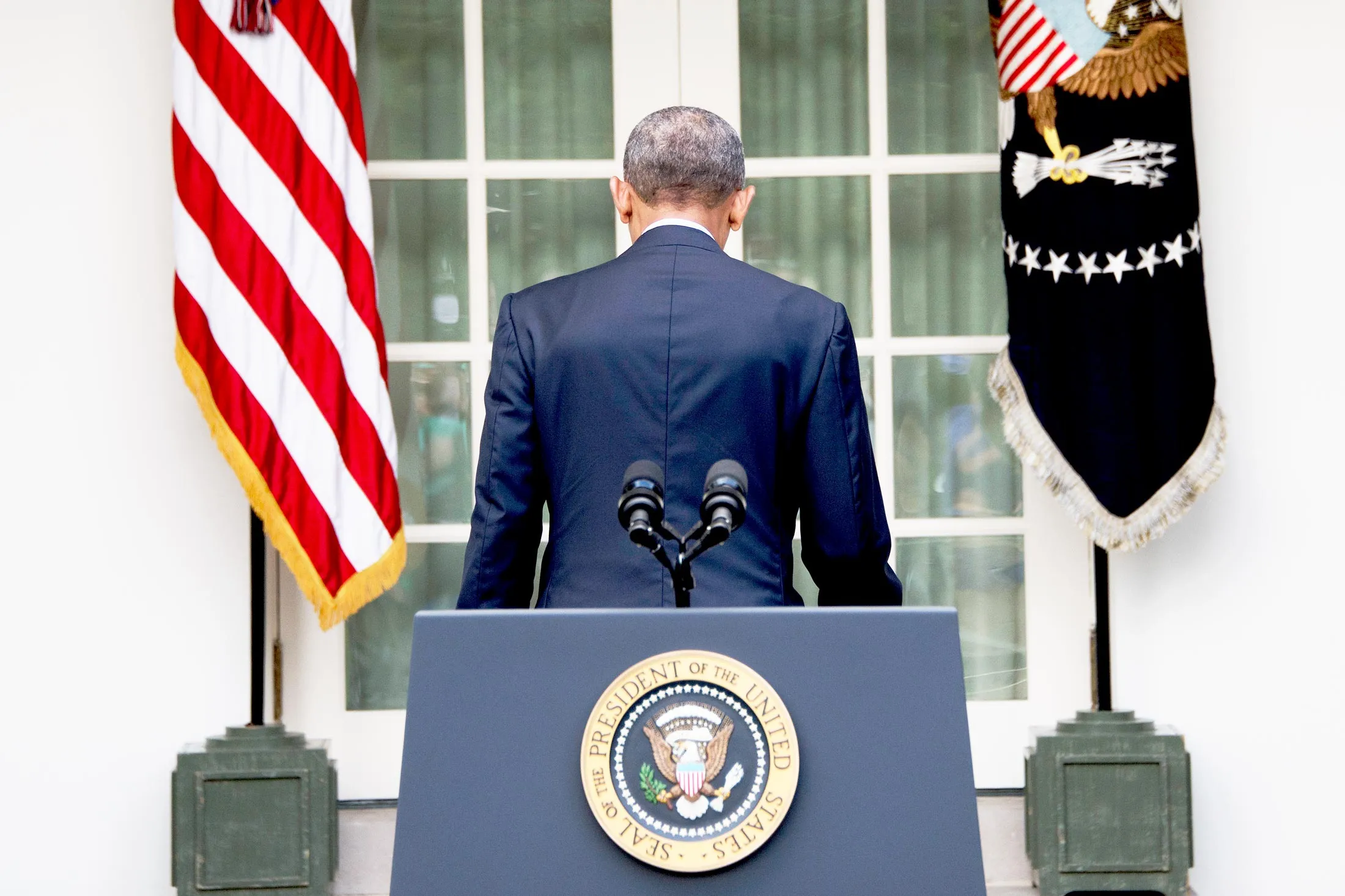 Obama departs after speaking about the Paris agreement from the Rose Garden in October.
