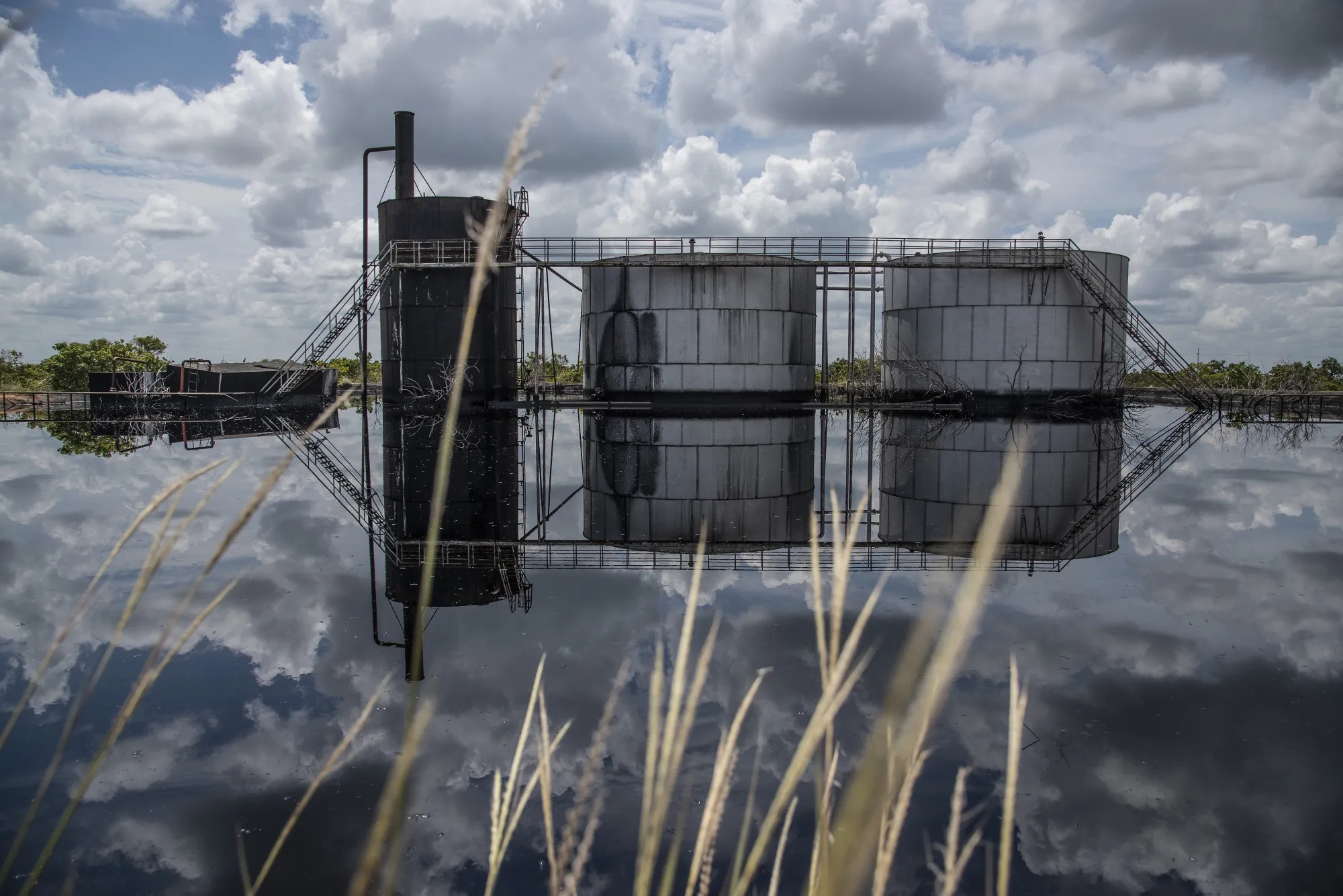 Oil tanks stand at a Petroleos de Venezuela SA (PDVSA) facility.