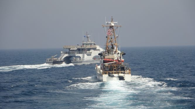 An Iranian Islamic Revolutionary Guard Corps Navy vessel crosses the bow of Coast Guard patrol boat USCGC Monomoy in the Persian Gulf on April 2.
