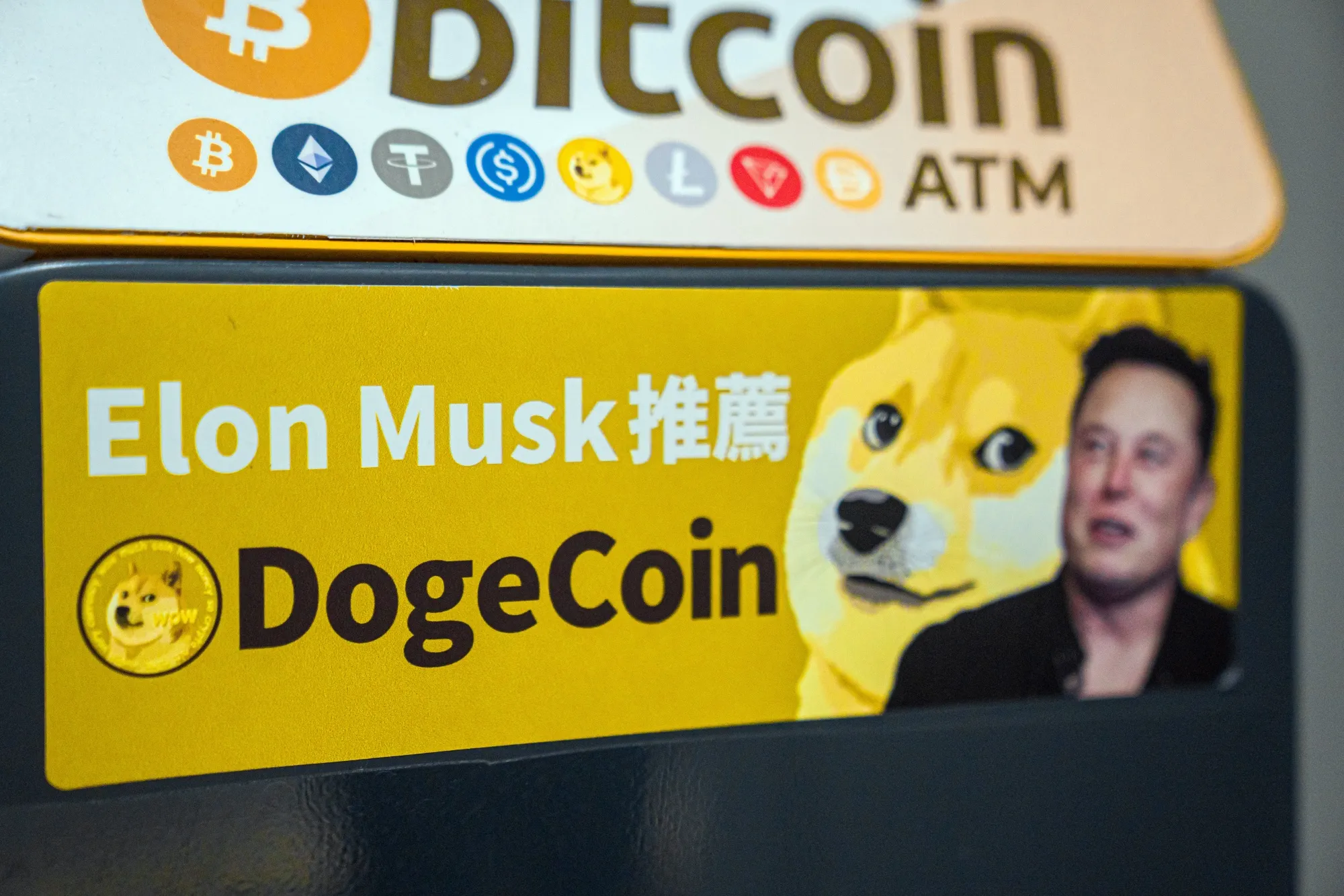 A screen showing the price of Dogecoin against the US dollar including Ether and Dogecoin displayed at a Crypto Panda cryptocurrency store in Hong Kong.
