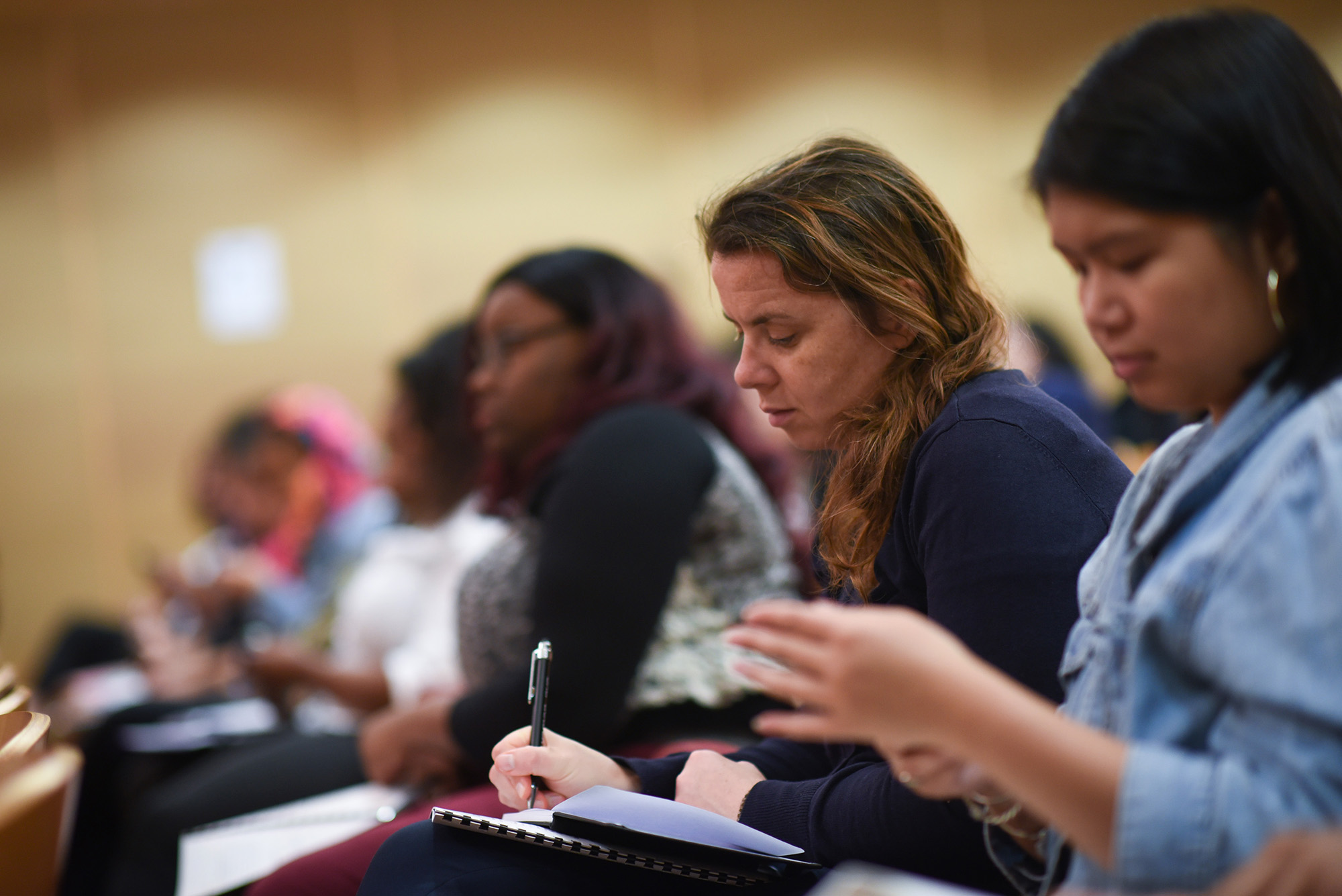 Attendees take notes at the Ask for More Work: Smart Salary Negotiation for Women session&nbsp;in New York&nbsp;on Sept. 24.