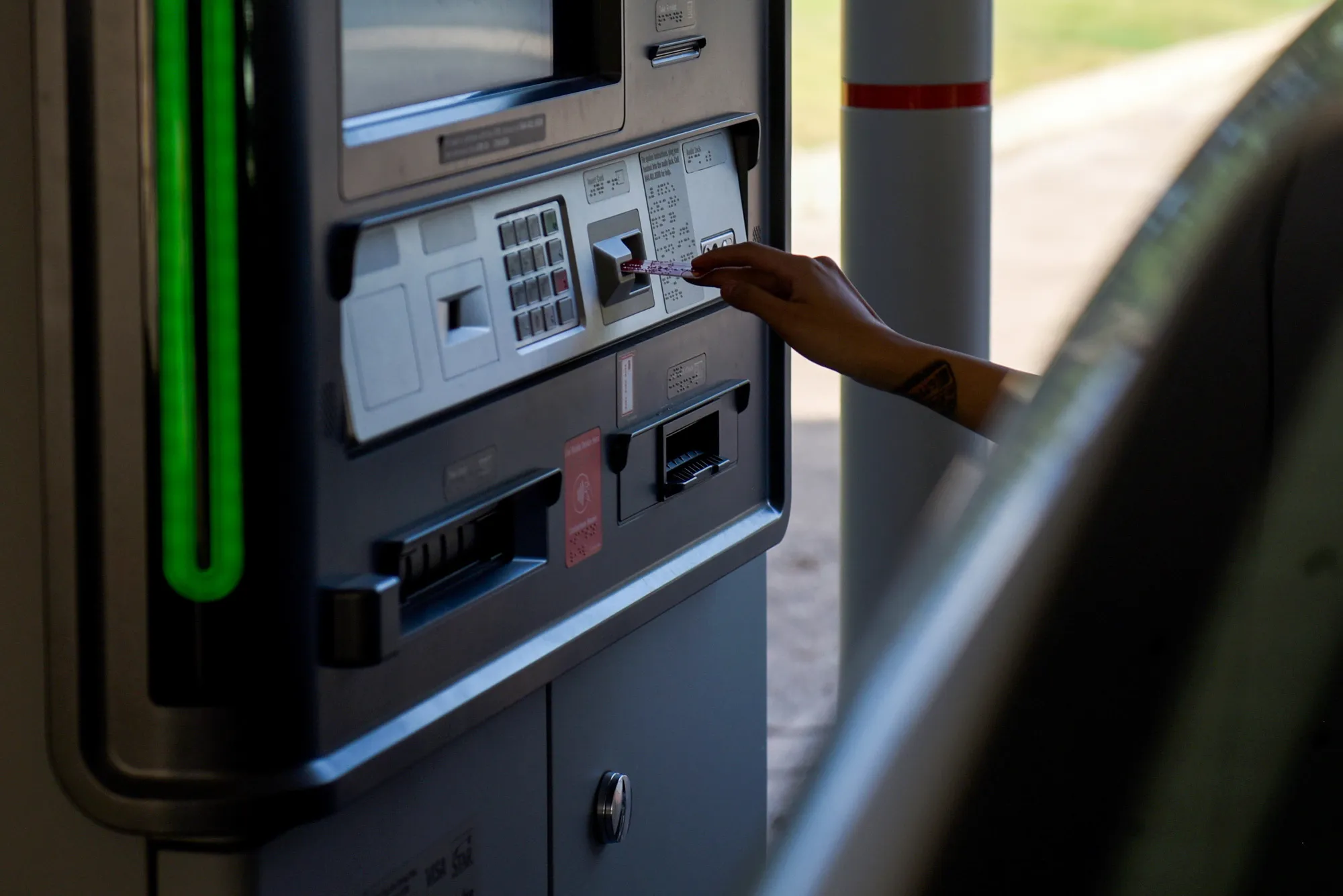 A customer uses a drive-thru ATM&nbsp;at a bank branch in San Antonio, Texas.