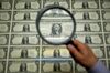 A magnifying glass is held over a 50 subject one dollar note sheet after being printed by an intaglio printing press in this arranged photograph at the U.S. Bureau of Engraving and Printing in Washington, D.C., U.S., on Tuesday, April 14, 2015. Republican efforts to pass a fiscal year 2016 budget cleared another hurdle as the House named its members to a conference committee and Senate Majority Leader Mitch McConnell pledged to do the same by the end of the week.