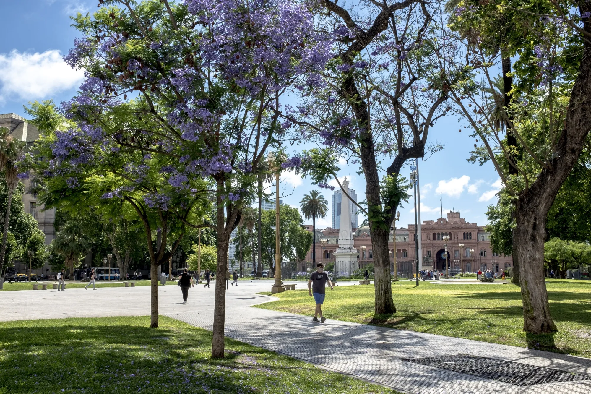 Pedestrians walk past the Casa Rosada in Buenos Aires, Argentina, on Monday, Dec. 6, 2021.