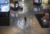 A security guard wears a protective mask as he stands in a nearly empty shopping mall on February 22, 2020 in Beijing.