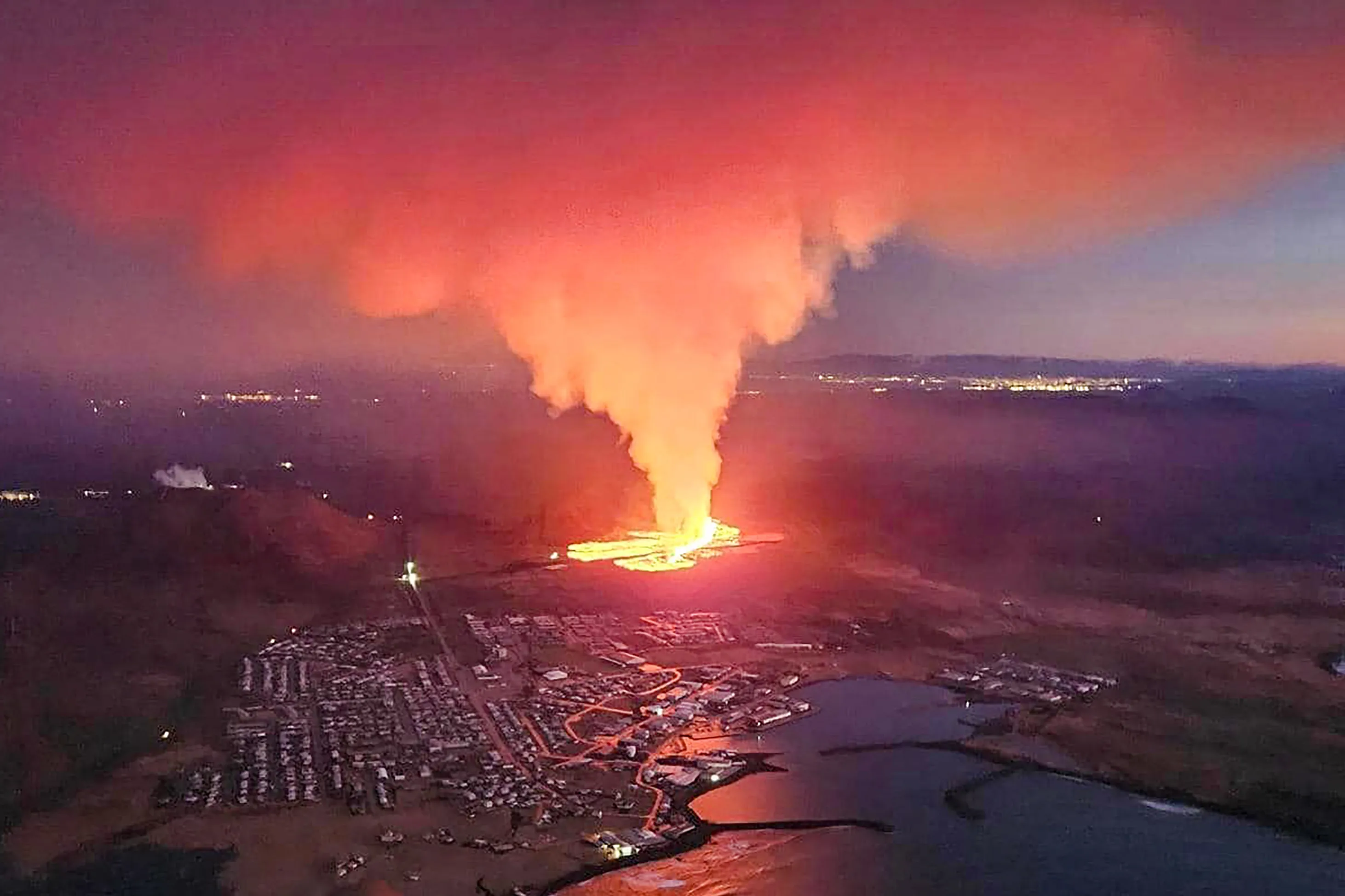Smoke and flowing lava during a volcanic eruption near Grindavik, Iceland on Jan. 14.