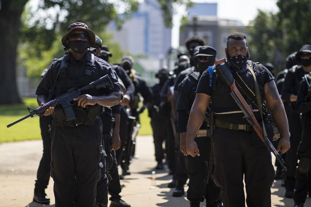 Members of a protestor group affiliated gather to march in Lousiville, Kentucky, on July 25.