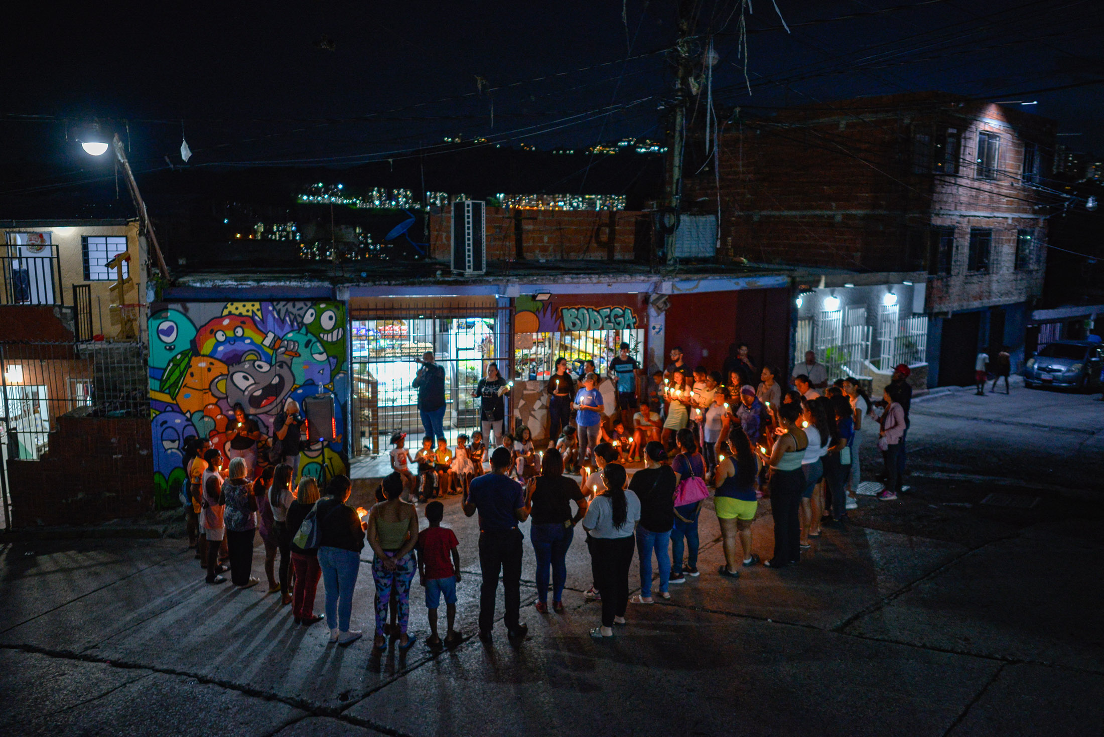 Residents gather during a vigil after the disputed presidential elections, in the Petare neighborhood of Caracas.