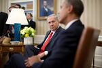 Benjamin Netanyahu, Israel's prime minister, left, looks on as U.S. President Barack Obama speaks in the Oval Office of the White House in Washington, D.C., on March 3, 2014.
