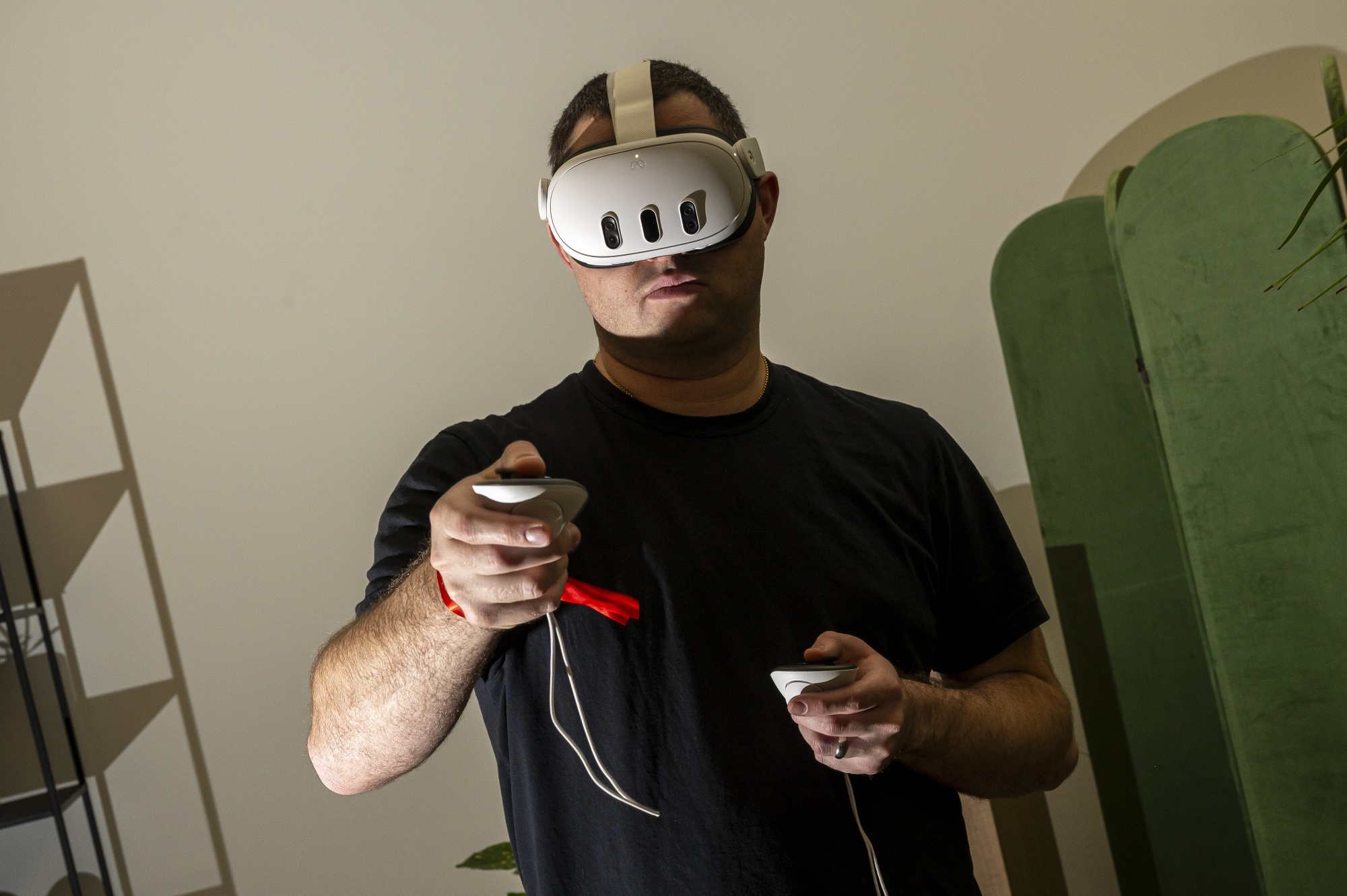 An attendee uses a Meta Quest 3 virtual reality&nbsp;headset during an event.