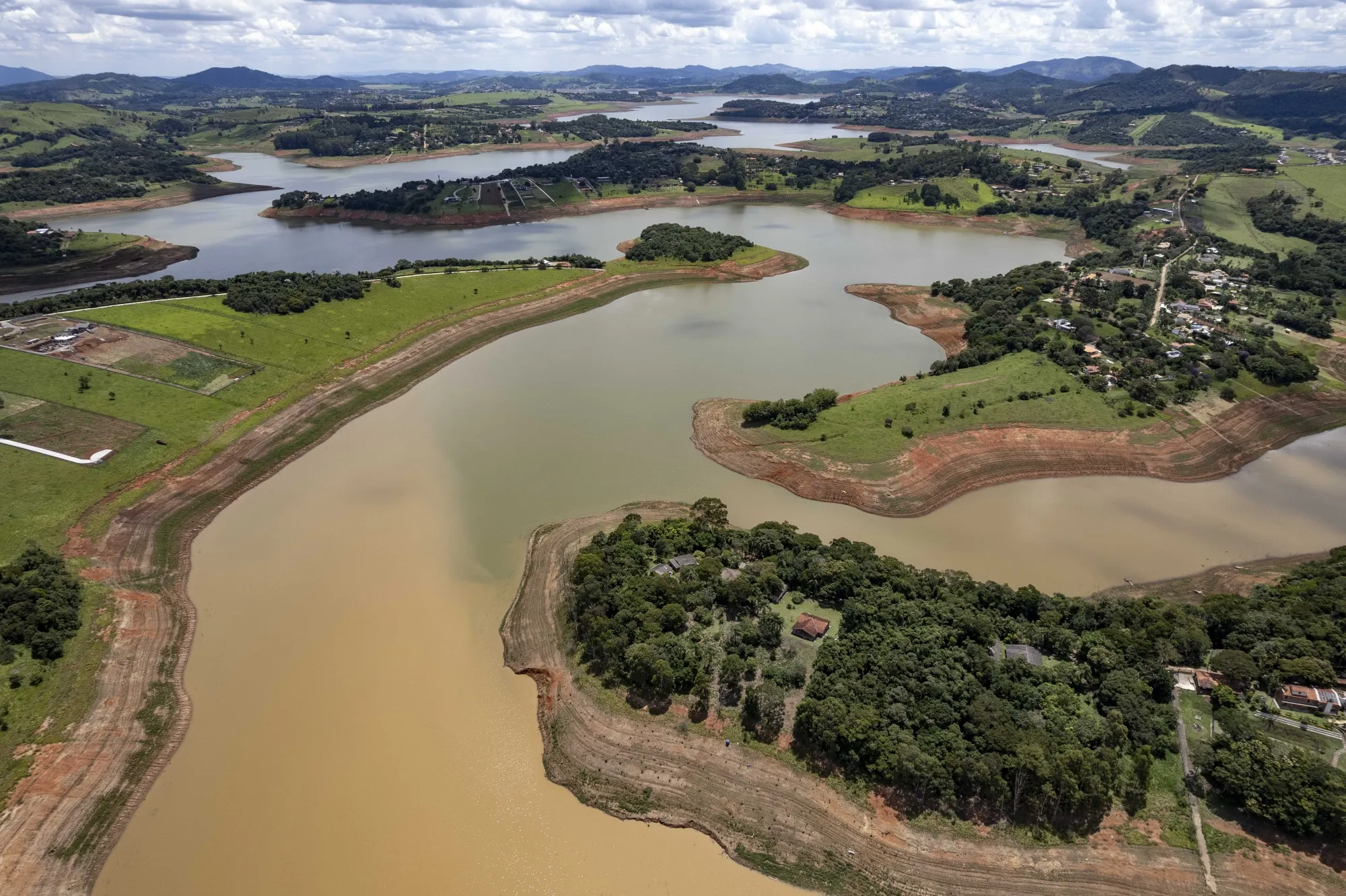 Water level lines appear on the shorelines of the Jacareí River Dam, part of the Cantareira reservoir system, during drought conditions&nbsp;in Joanopolis, Sao Paulo state.