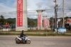 A motorcyclist rides past the construction site of the Luang Prabang railway bridge, a section of the China-Laos Railway built by the China Railway Group Ltd., near Luang Prabang, Laos, on Sunday, Oct. 21, 2018. China's Belt and Road initiative plans to connect Southeast Asian countries with the southwest region of Yunnan through a series of high-speed railways. There are three routes planned: a central one that runs through Laos, Thailand and Malaysia to reach Singapore; a western route through Myanmar; and an eastern one through Vietnam and Cambodia. Photographer Taylor Weidman/Bloomberg