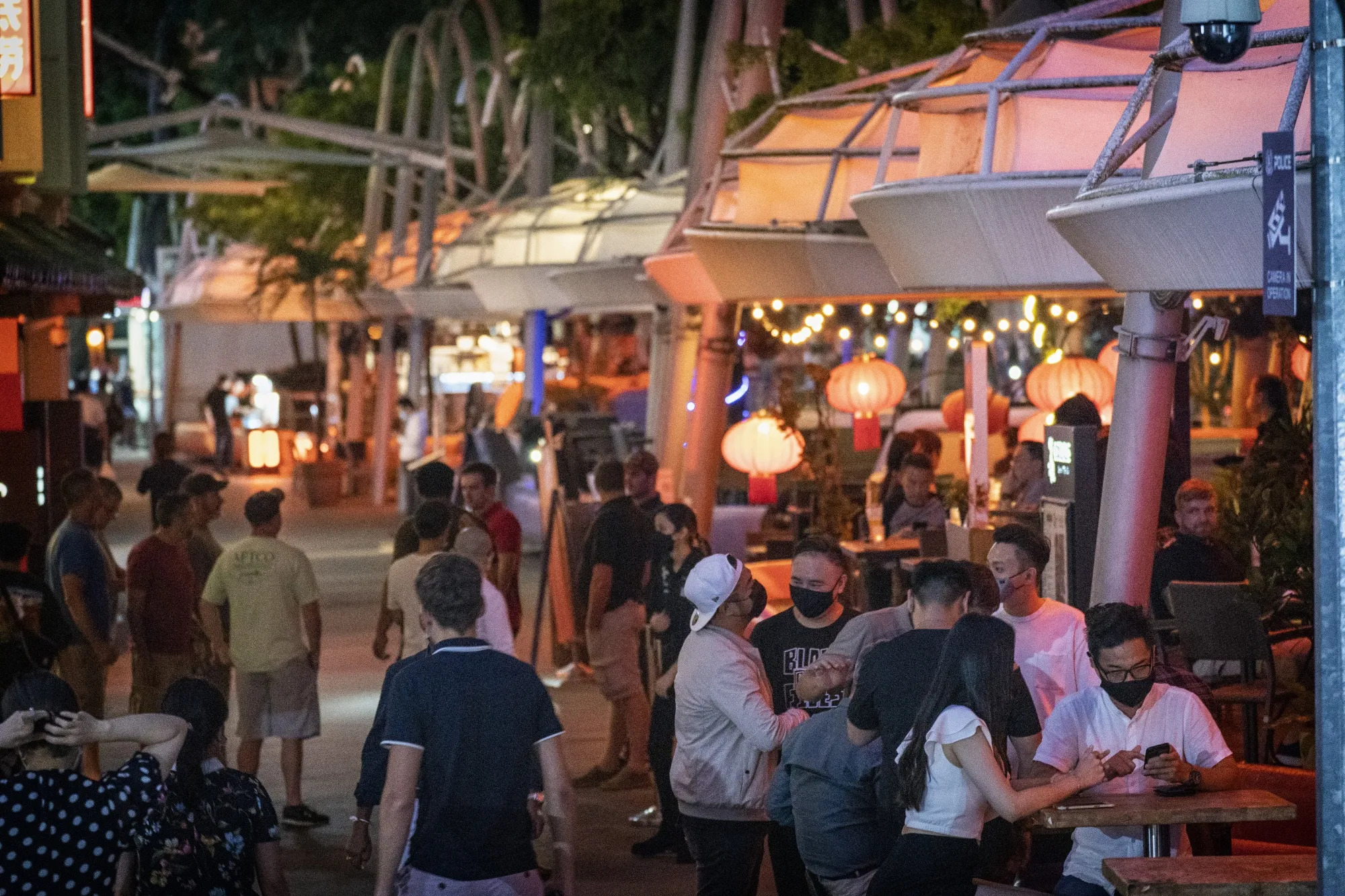 Customers outside a bar in Clarke Quay, Singapore in March.