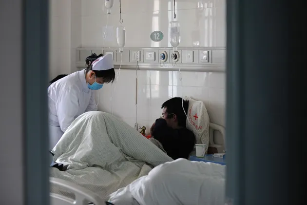 A nurse attends to patients at a hospital in Hefei in eastern China’s Anhui province