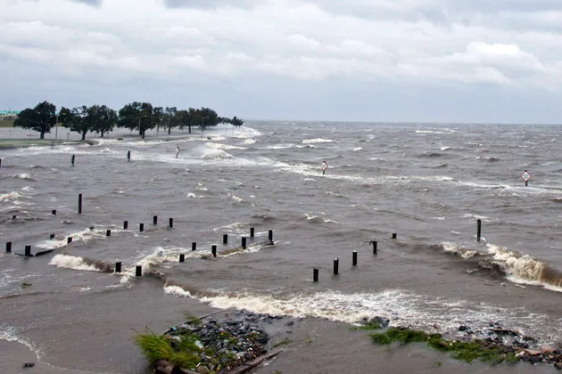 A storm surge causes tides to rise as rough waves pound the concrete seawall along the shores of Lake Pontchartrain in New Orleans as Hurricane Isaac makes landfall along the Gulf Coast