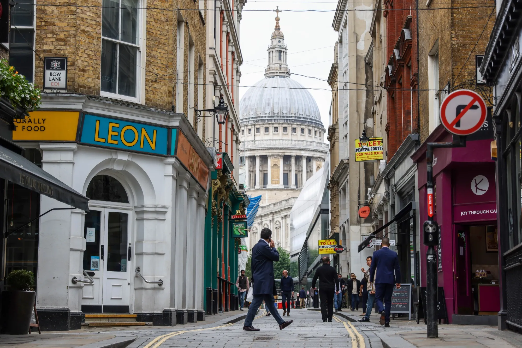 Pedestrians walk&nbsp;along Watling Street in London, on July 12.