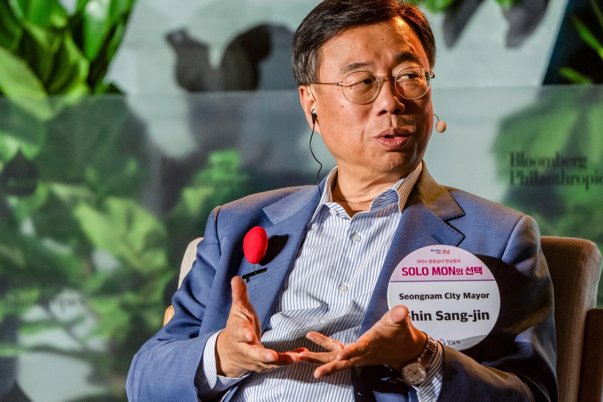 Seongnam Mayor Shin Sang-jin wears a sample of the name tags donned at his city’s matchmaking events during the Bloomberg CityLab conference in Mexico City.