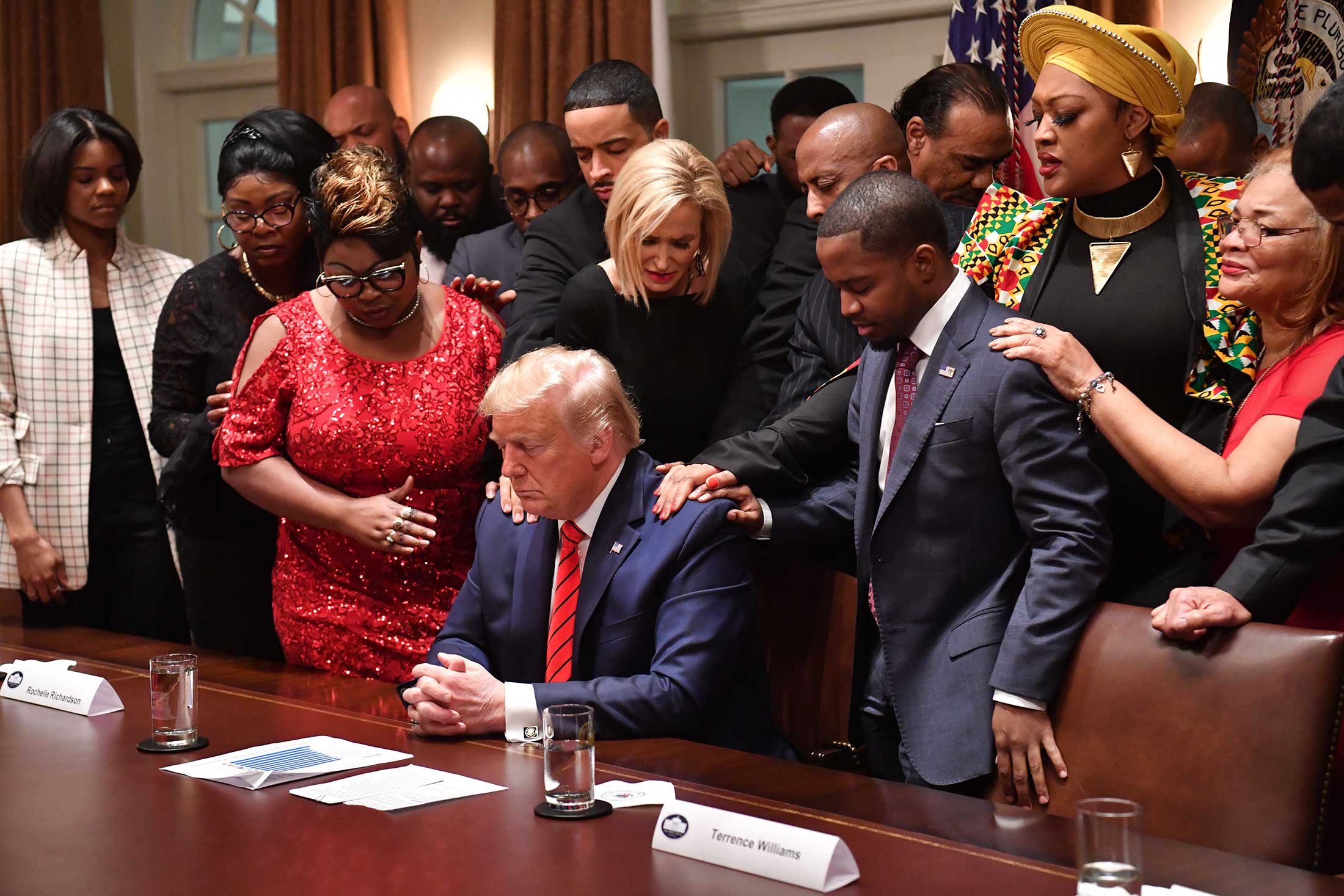 Black supporters pray with President Trump at the White House on Feb. 27.&nbsp;