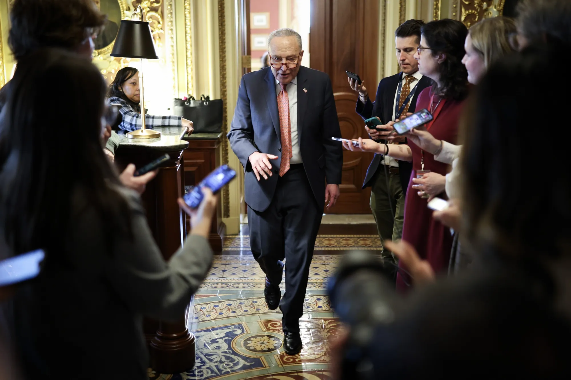 Senate Democratic Leader Chuck Schumer leaves the Democratic caucus lunch at the U.S. Capitol on March 13.