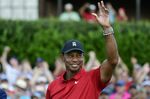 Tiger Woods celebrates on the 18th green after wining the Tour Championship golf tournament Sunday, Sept. 23, 2018, in Atlanta. Woods will be the star attraction in the World Golf Hall of Fame induction ceremony Wednesday, March 9, 2022. (AP Photo/John Amis, File)