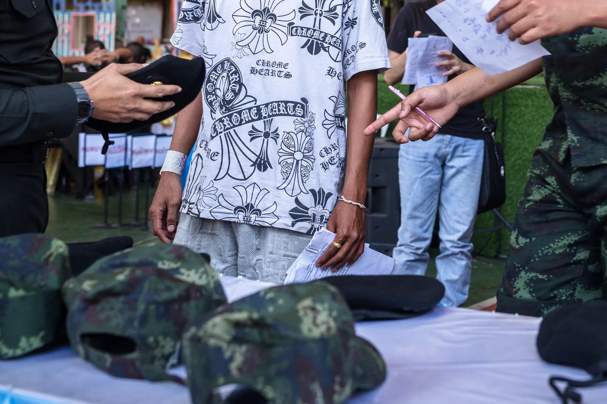 A man tries on a military outfit in Bangkok on April 7.