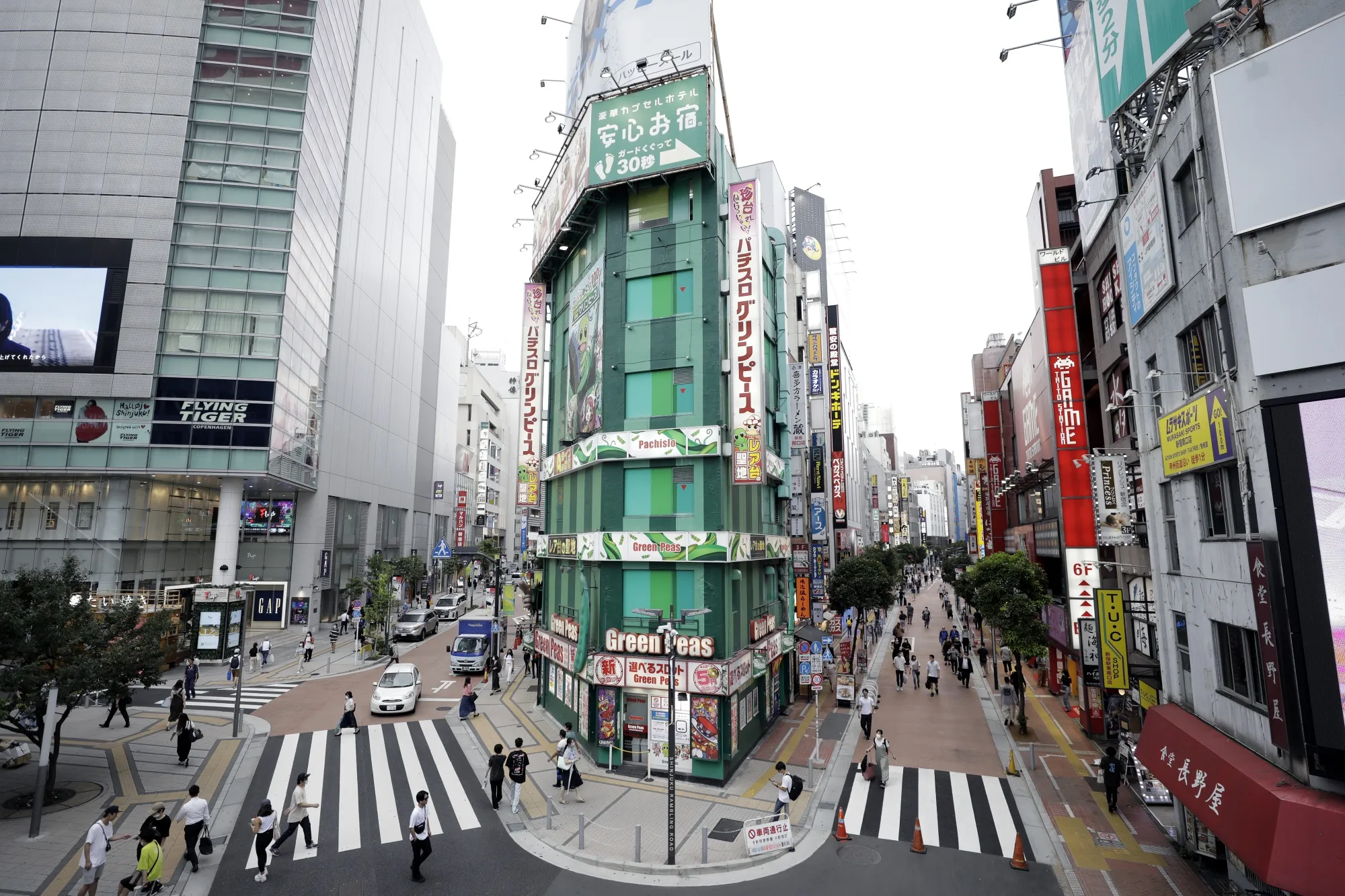 Pedestrians in the Shinjuku district of Tokyo in July.