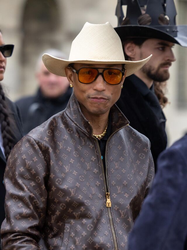 Pharrell wearing a Louis Vuitton jacket.