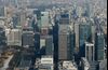Commercial buildings stand in the Marunouchi area in this aerial photograph taken in Tokyo, Japan, on Monday, Dec. 2, 2013. Japan's gross domestic product rose an annualized 1.9 percent in the July-September period after gaining 3.8 percent the previous quarter, the Cabinet Office reported on Nov. 14.